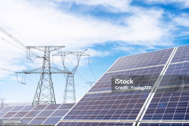 Solar Panels And Highvoltage Towers Stock Photo - Download Image Now - Solar Panel, Electricity Pylon, Solar Power Station