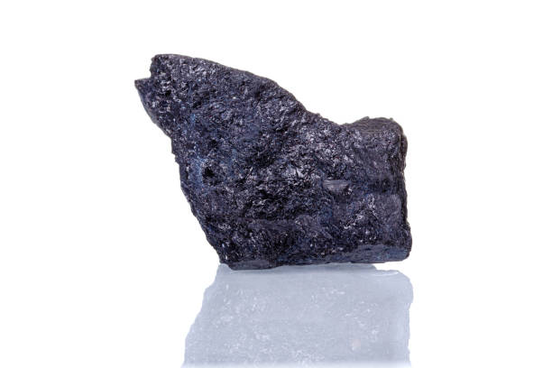 istock macro mineral stone Schorl on a white background 1334077835