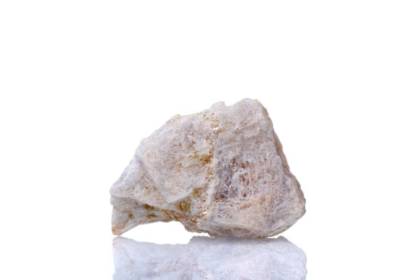istock macro mineral stone Wollastonite on a white background 1334077849