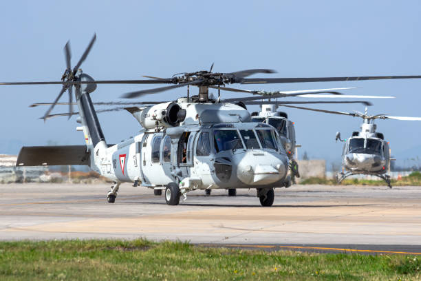 Mexican Air Force Sikorsky UH-60M Blackhawk Zumpango, México - septiembre 16, 2019: Mexican Air Force Sikorsky UH-60M Blackhawk, taxing to the runway ready to departure Santa Lucia AFB in Mexico due to the Mexican Independance Day in September 16th, in the background the Bell 412. blackhawk stock pictures, royalty-free photos & images