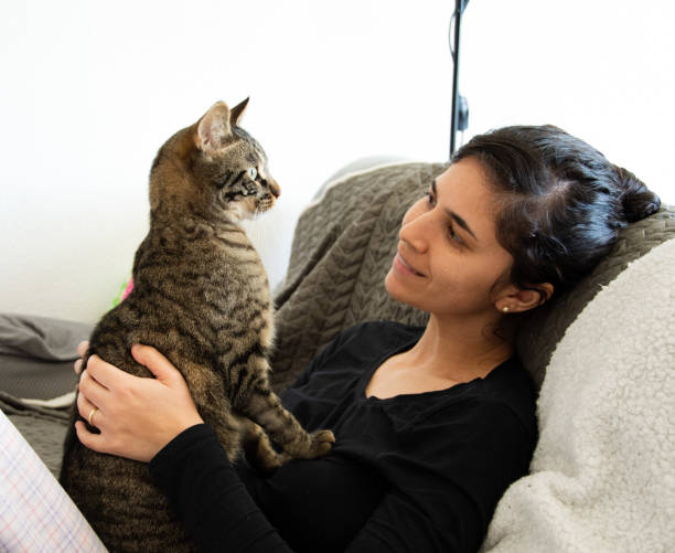 istock Woman and cat 1334080981