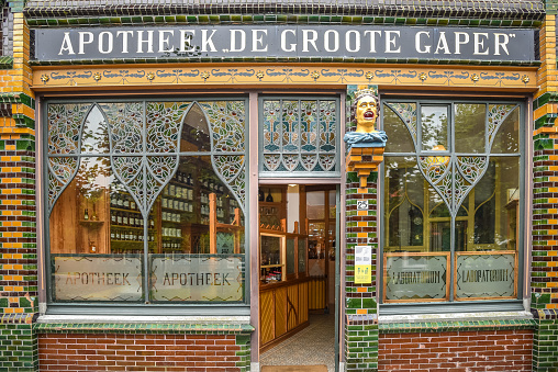 Enkhuizen, the Netherlands - September 2, 2020. The shop window of an old Dutch pharmacy with the iconic symbol of the gaper