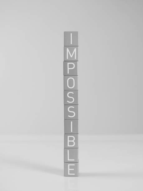 Impossible Impossible word from letter blocks. impossible possible stock pictures, royalty-free photos & images