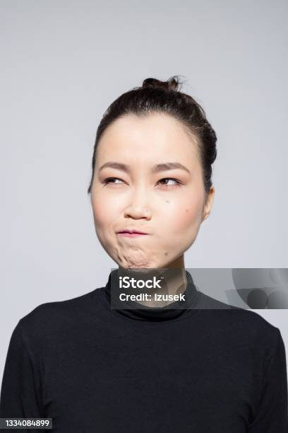 Confused Asian Young Woman Stock Photo - Download Image Now - Searching, Confusion, Uncertainty