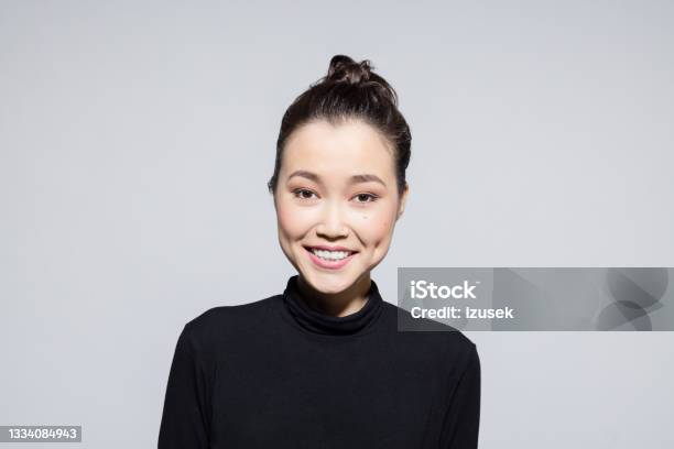 Excited Asian Young Woman Stock Photo - Download Image Now - One Woman Only, Women, Black Color