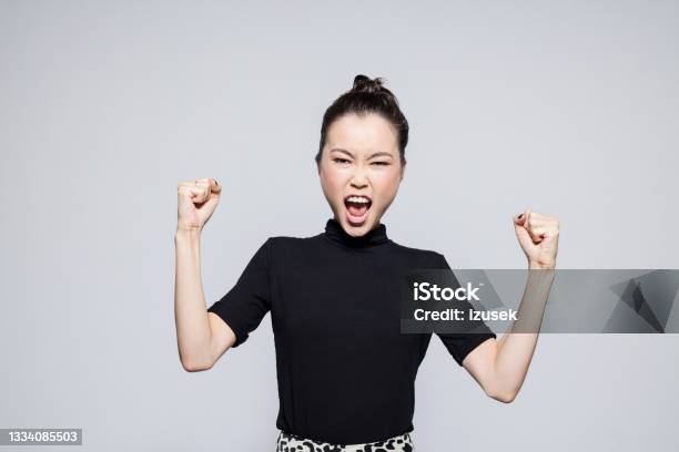Excited Asian Young Woman Stock Photo - Download Image Now - Women, Winning, Businesswoman