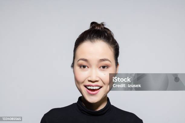 Excited Asian Young Woman Stock Photo - Download Image Now - Turtleneck, Women, 20-24 Years