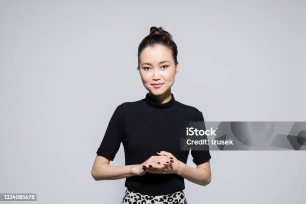 Friendly Asian Young Woman Stock Photo - Download Image Now - Mongolian Ethnicity, Greeting, Businesswoman