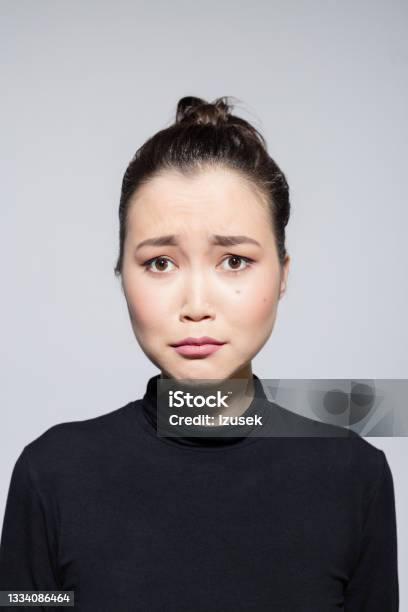 Sad Asian Young Woman Stock Photo - Download Image Now - Women, One Woman Only, Asian and Indian Ethnicities