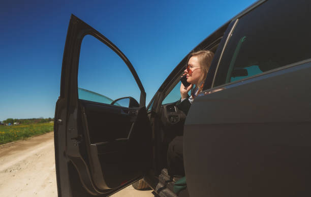 istock Woman calling by smartphone from the car. 1334091711