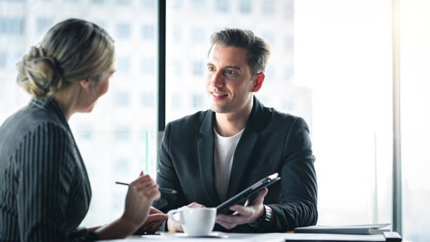 istock Two business people having a discussion. 1334092643