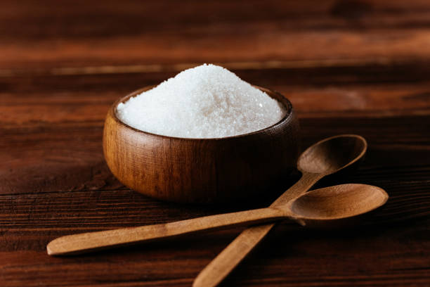 istock white sugar in a wooden bowl 1334094116