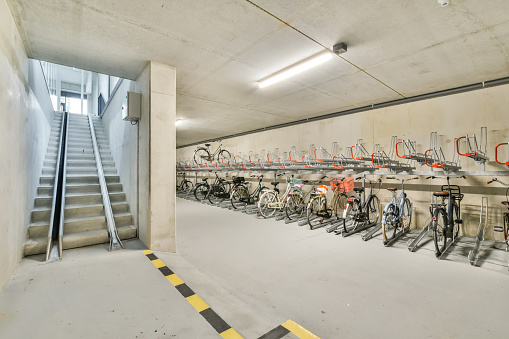Interior of modern bicycles or bike parking in Amsterdam, North Holland, Netherlands