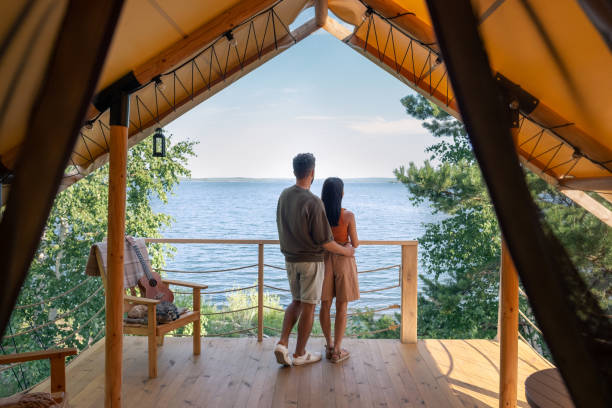 istock rear view of affectionate couple enjoying summer vacation 1334096782
