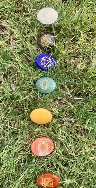 istock Chakras gemstones in grass background 1334097602