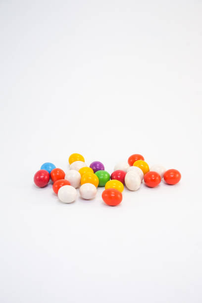 Chocolate candy with colorful dry cream coating