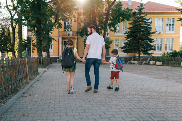 istock Father taking the kids to school 1334103598