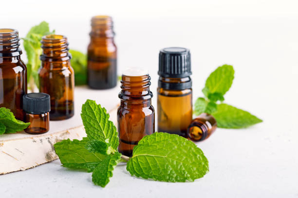 istock amber bottles with fresh mint leaves 1334104890