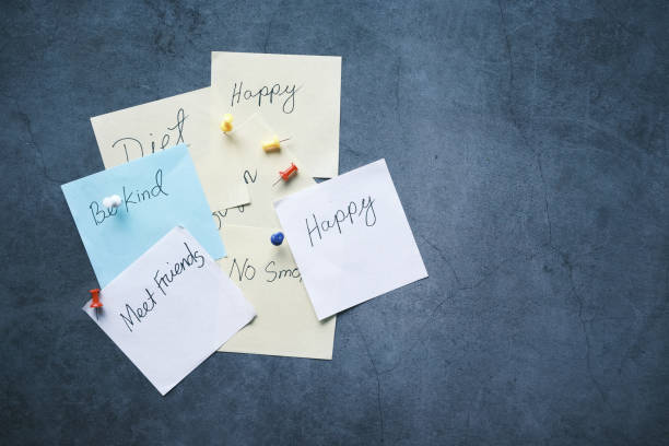 istock new year goals on a sticky note on table , 1334104999