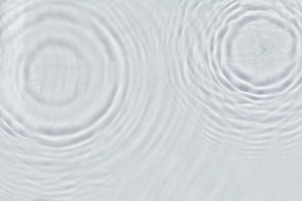 istock Abstract water texture, surface with drops, rings and ripple. 1334106066