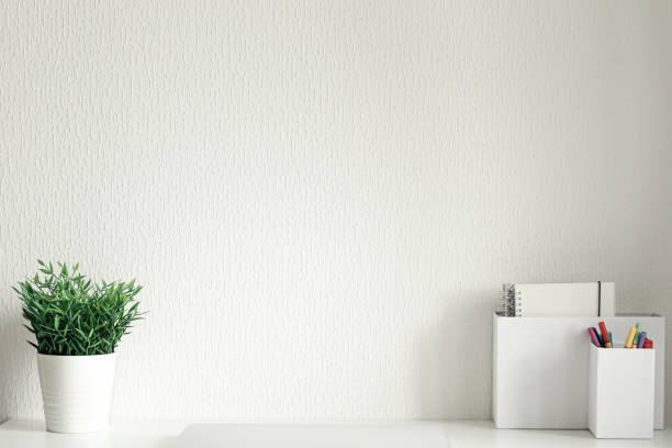 istock Workspace with white table and laptop, minimalism workplace interior, nobody 1334106524