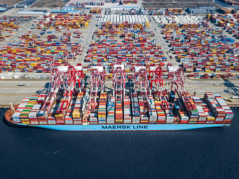 A large Maersk container ship being loaded in Shanghai Yangshan Port