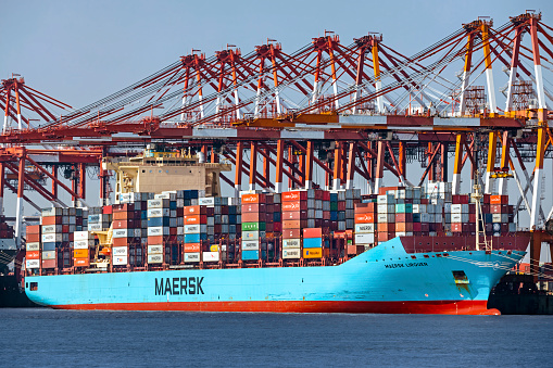 A Maersk container ship being loaded in Shanghai Yangshan Port