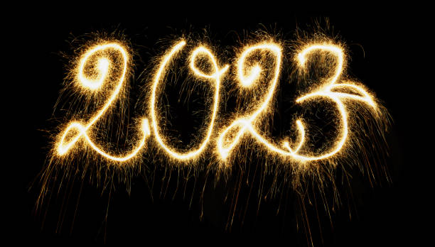 Sparkling New Year 2023 Sparkling  Year 2023 painted with sparkles. Written on a deep black background. 2023 photos stock pictures, royalty-free photos & images