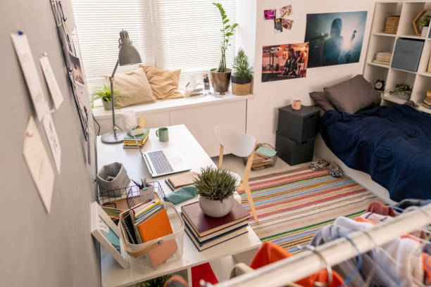 istock Part of bedroom interior with bed, workplace and other stuff 1334115754