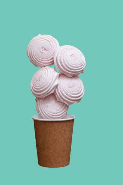 istock marshmallows in a paper cup isolated on green background 1334125133