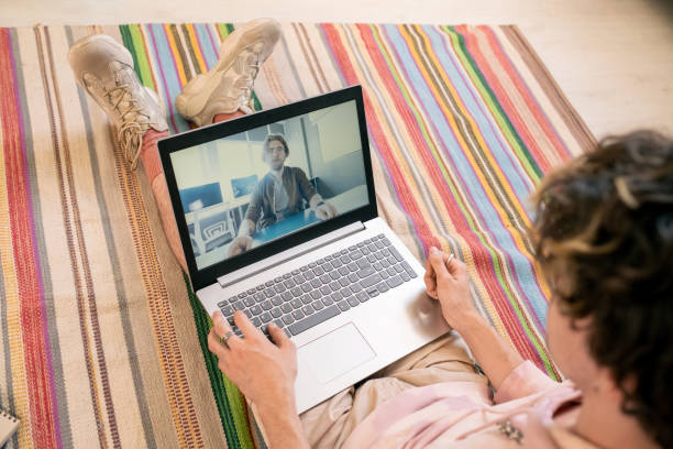 istock Teenage student communicating with teacher during online lesson 1334127509