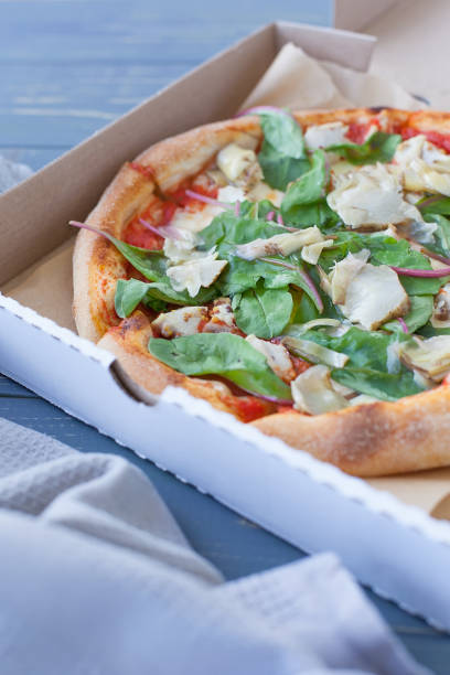 istock pepperoni pizza on wooden board. hot Pizza 1334129808