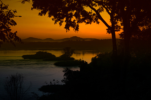 Last minutes before sunrise at the Victoria Nile River in Western Uganda, only a few kilomenters after the outflow from Lake Victoria, just before the Busowoko Falls.