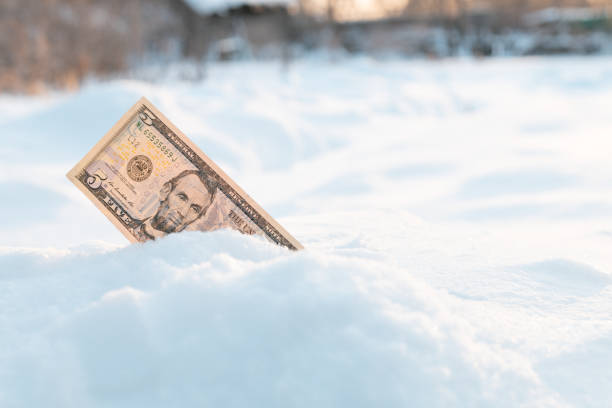 istock money sticking out of a snowdrift 1334130924