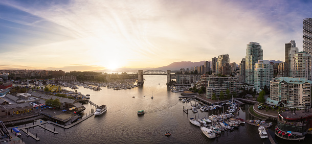View of Burrard Bridge and False Creek in Downtown Vancouver, British Columbia, Canada. Sunny summer sunset Sky Art Render.