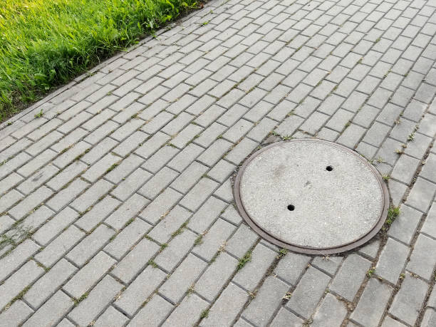 istock Sewage gully located on the pavement 1334133986