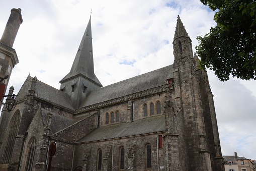 The collegiate church of Saint Aubin is located in the center of the medieval city of Guerande  surrounded by its ramparts. It is located in the French department of Loire Atlantique