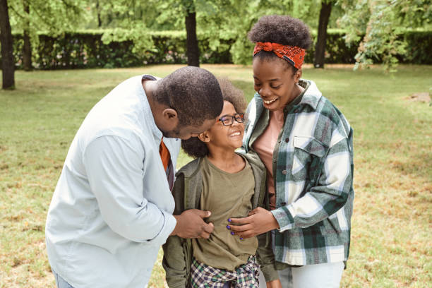 istock Happy young parents tickling their cute son 1334137202