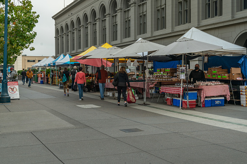 A busy early morning farmers market outside the ferry Building on the Embarcadero