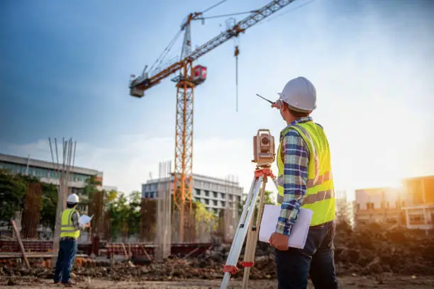 Surveyor equipment. Surveyor"u2019s telescope at construction site or Surveying for making contour plans is a graphical representation of the lay of the land startup construction work.