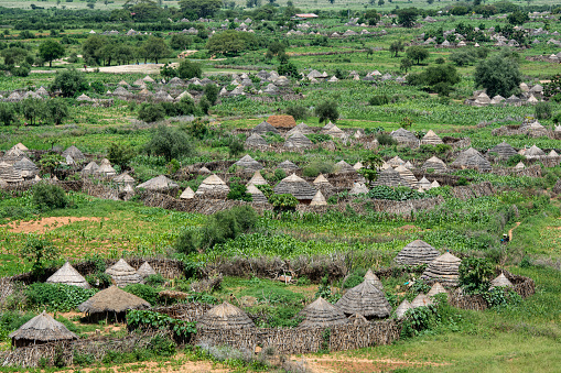 Aerial view of the typical village of the Karamojong (or Karimojong) people in the North east of Uganda, right at the border to South Sudan and also close to the border to Kenya. The region is called Karamoja. \n\nThe Karamojong are a Nilotic ethnic group and according to anthropologists, the Karamojong are part of a group that migrated from present-day Ethiopia around 1600 A.D. The main livelihood activity of the Karamojong is still  herding livestock, while cultivation of crop is only a secondary activity.