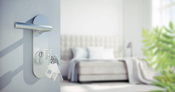 istock Open door to spacious white bedroom 1334140536