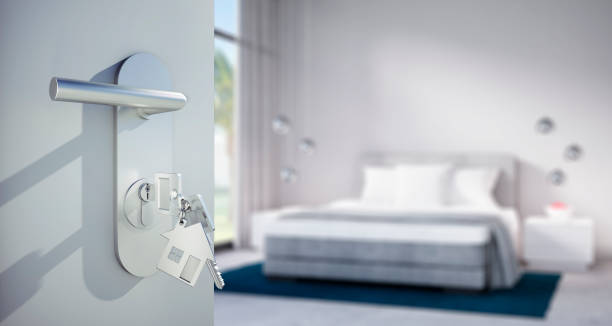 istock Open door to spacious white bedroom 1334140541