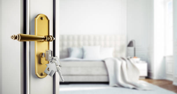 istock Open door to spacious white bedroom 1334140542