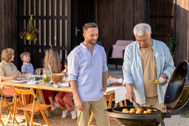 istock Large restful family enjoying picnic on weekend 1334146054