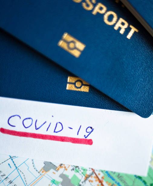 istock Passport and note with Covid-19 inscription. 1334150345