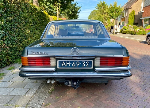 Aalsmeer,  the Netherlands, -  August  13, 2021. Retro Mercedes limousine car parked in the city Street.