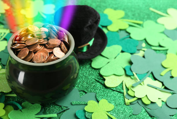 istock Pot with gold coins, hat and clover leaves on table, space for text. St. Patrick's Day celebration 1334151230