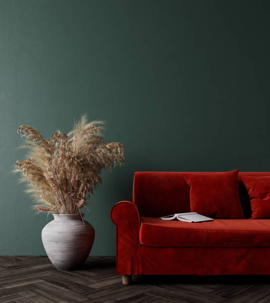 istock Modern interior design with red couch, dry plants decoration and empty olive green mock up wall 1334158842