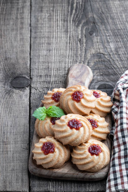 istock Qurabiya cookie shortbread with jam on rustic wooden table 1334159027